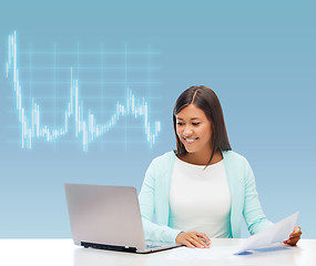 Image showing asian businesswoman with laptop and documents