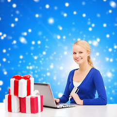 Image showing woman with gifts, laptop computer and credit card