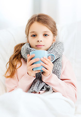 Image showing ill girl child with cup of hot tea