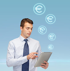 Image showing buisnessman with tablet pc and euro icons