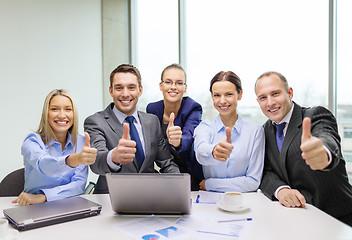 Image showing business team showing thumbs up in office