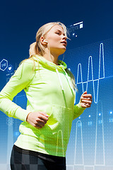 Image showing fit woman doing running outdoors