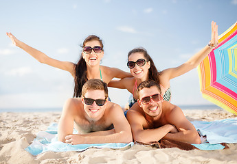 Image showing group of smiling people having fun on the beach