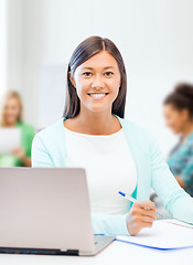 Image showing asian businesswoman with laptop and documents