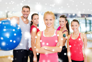 Image showing woman standing in front of the group in gym