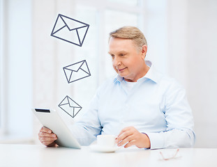 Image showing old man with tablet pc computer at home