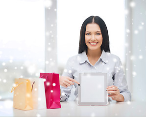 Image showing smiling woman with blank screen tablet pc