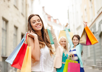 Image showing beautiful woman with shopping bags in the ctiy