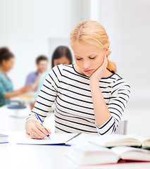 Image showing concentrated woman studying in college