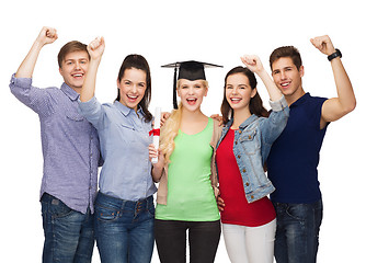 Image showing group of standing smiling students with diploma