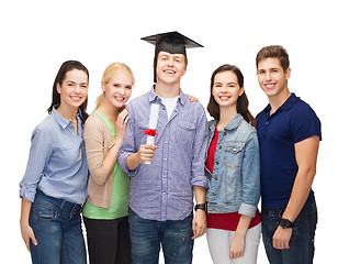 Image showing group of standing smiling students with diploma