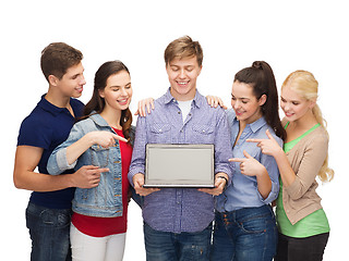 Image showing smiling students with laptop computer