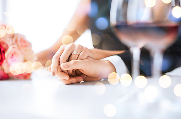 Image showing engaged couple with wine glasses