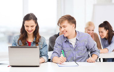 Image showing students with laptop and notebooks at school