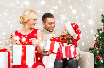 Image showing happy family opening gift boxes