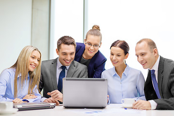 Image showing business team with laptop having discussion