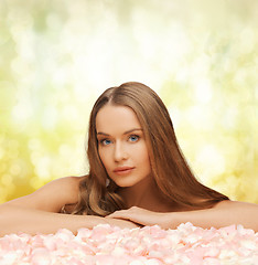 Image showing woman with long hair and rose petals