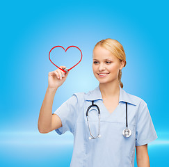 Image showing doctor or nurse drawing red heart