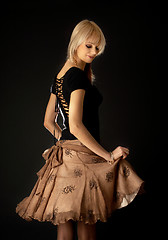 Image showing dancing blond in brown skirt