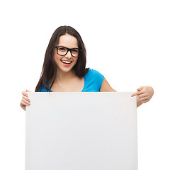 Image showing smiling girl with eyeglasses and white blank board