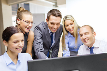 Image showing business team with monitor having discussion