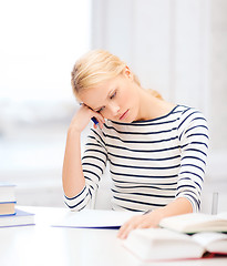 Image showing concentrated woman studying in college