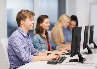 Image showing students looking at computer monitor at school