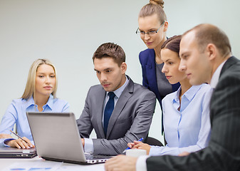 Image showing business team with laptop having discussion