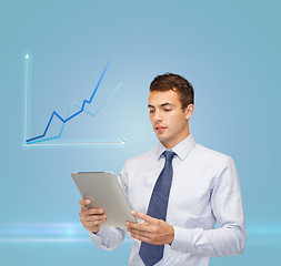 Image showing buisnessman with tablet pc and graph