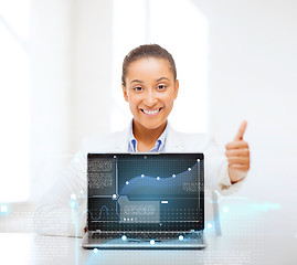 Image showing smiling woman with laptop computer