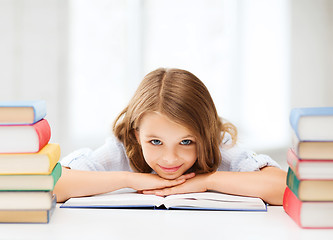 Image showing pretty girl with many books at school