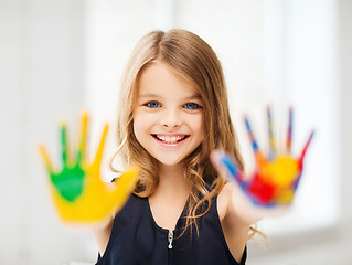 Image showing smiling girl showing painted hands