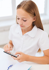 Image showing girl with smartphone at school