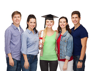 Image showing group of standing smiling students with diploma