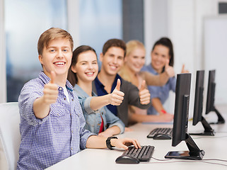 Image showing students with computer monitor showing thumbs up