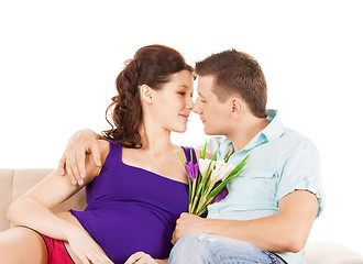 Image showing happy expecting parents at home