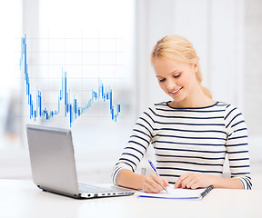 Image showing smiling student with laptop computer and documents