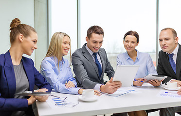 Image showing business team with tablet pc having discussion