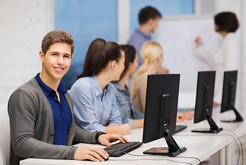 Image showing students with computer monitor at school