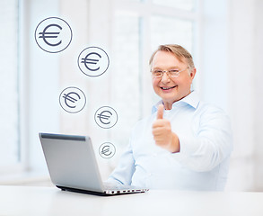 Image showing old man with laptop computer showing thumbs up