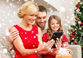 Image showing smiling family with tablet pc