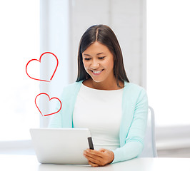 Image showing smiling woman with tablet pc