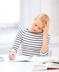 Image showing concentrated woman studying in college