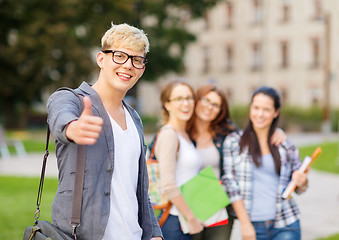 Image showing male student in eyglasses showing thumbs up