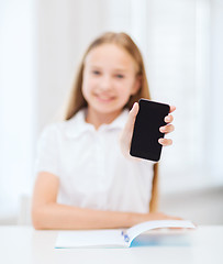 Image showing smiling student girl with smartphone at school