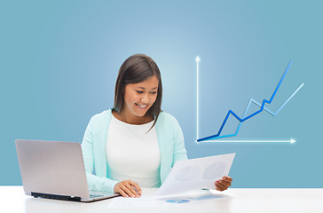 Image showing asian businesswoman with laptop and documents