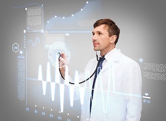 Image showing male doctor with stethoscope and cardiogram