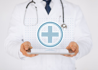 Image showing male doctor with stethoscope holding tablet pc