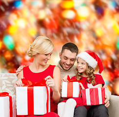 Image showing happy family opening gift boxes