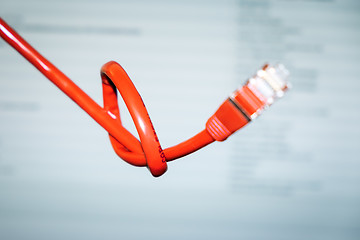 Image showing red networking cable with a knot